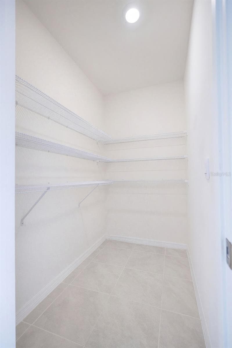 The Kitchen features a Large Walk-in Pantry - 2415 BRASSIE CT, WINTER HAVEN