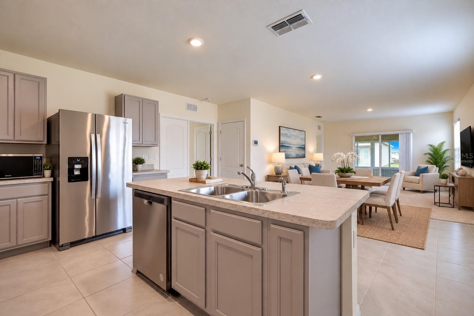Virtually Staged, The center island provides convenient seating for casual dining - 2415 BRASSIE CT, WINTER HAVEN