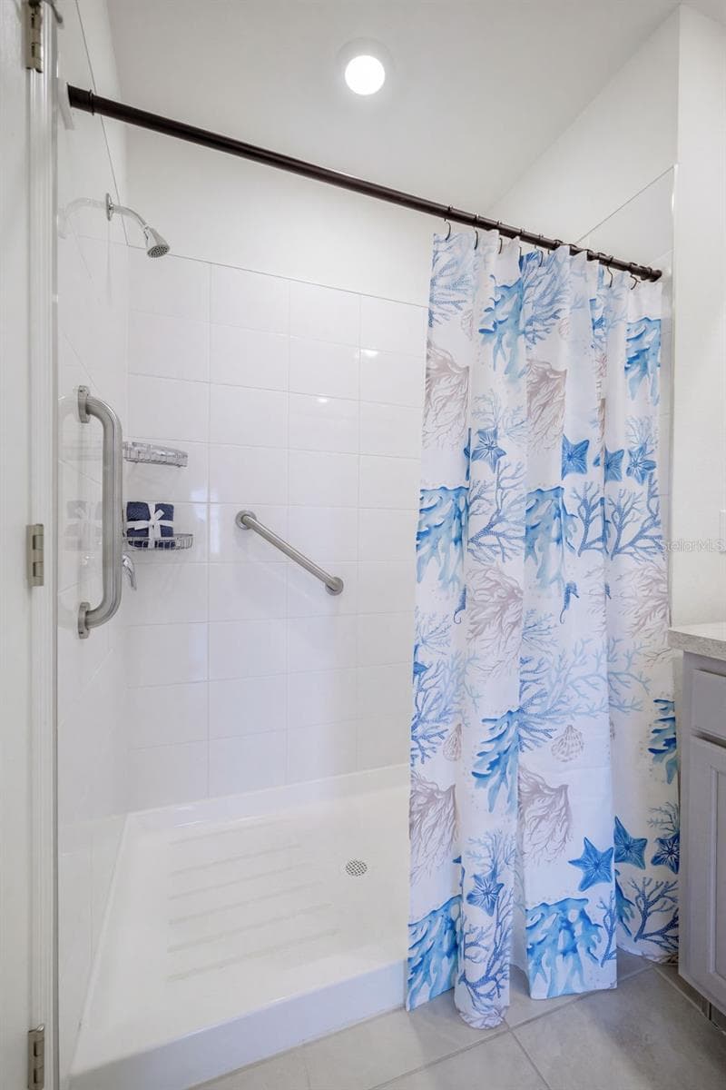 Walk-in shower with safety grab bars - 2415 BRASSIE CT, WINTER HAVEN