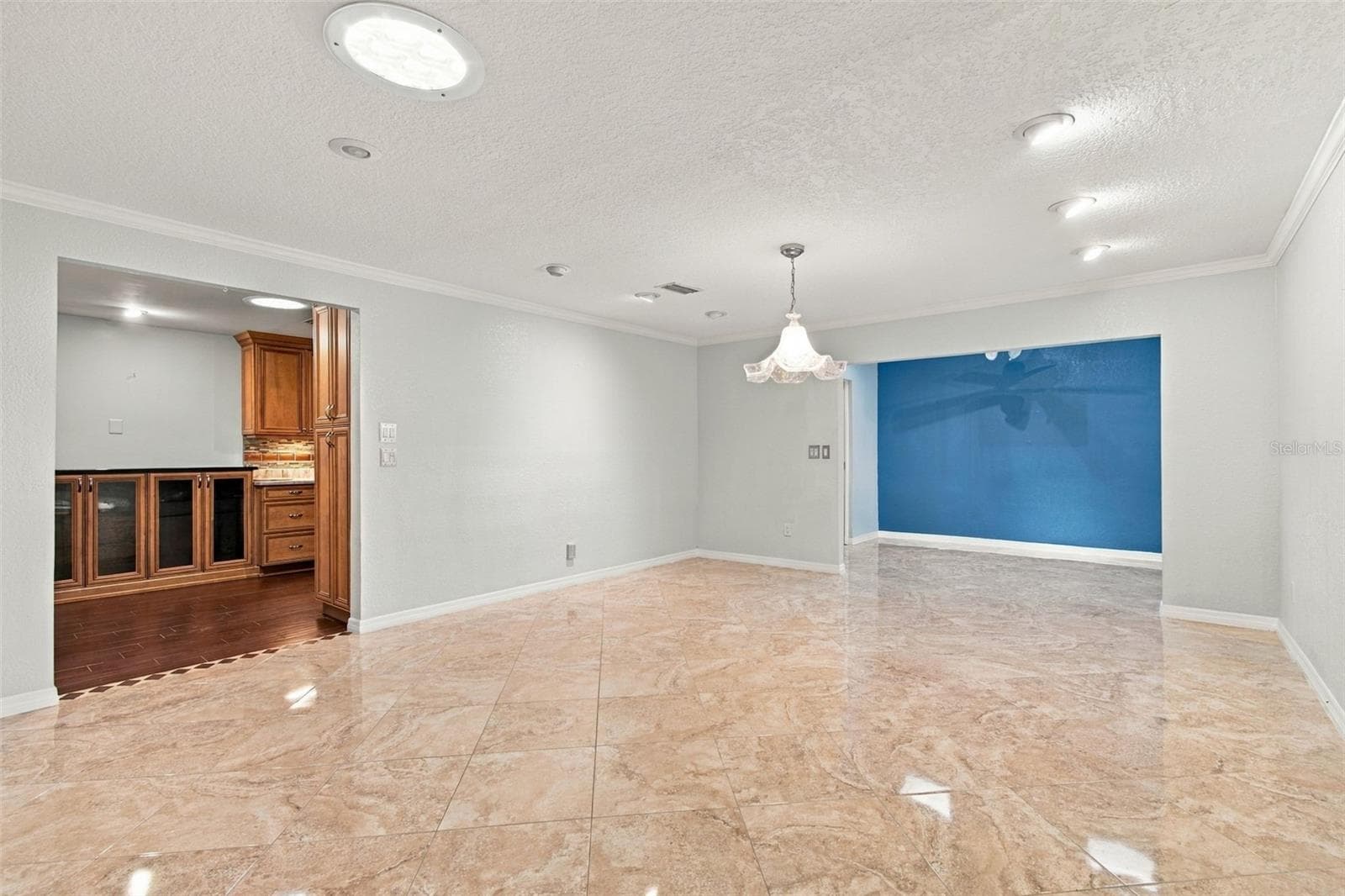 Wow! This dining room is huge and opens to the Sunroom on the right and the kitchen on the left. - 2254 HERON CIR, CLEARWATER