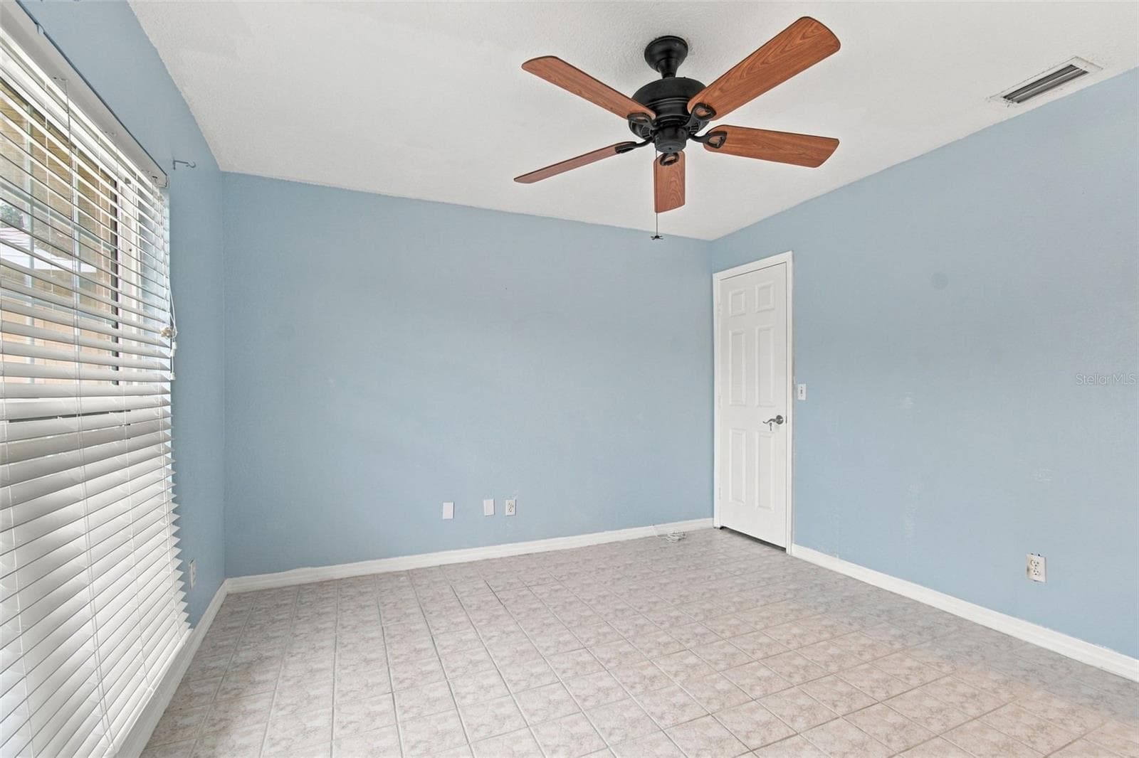 This is the front bedroom with a large walk-in closet. - 2254 HERON CIR, CLEARWATER