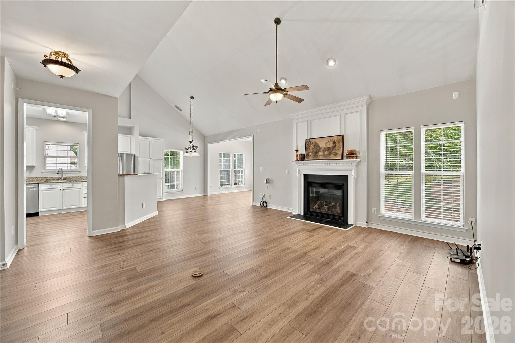 Newer LVP flooring throughout the downstairs - 195 Huntly Lane, Mooresville