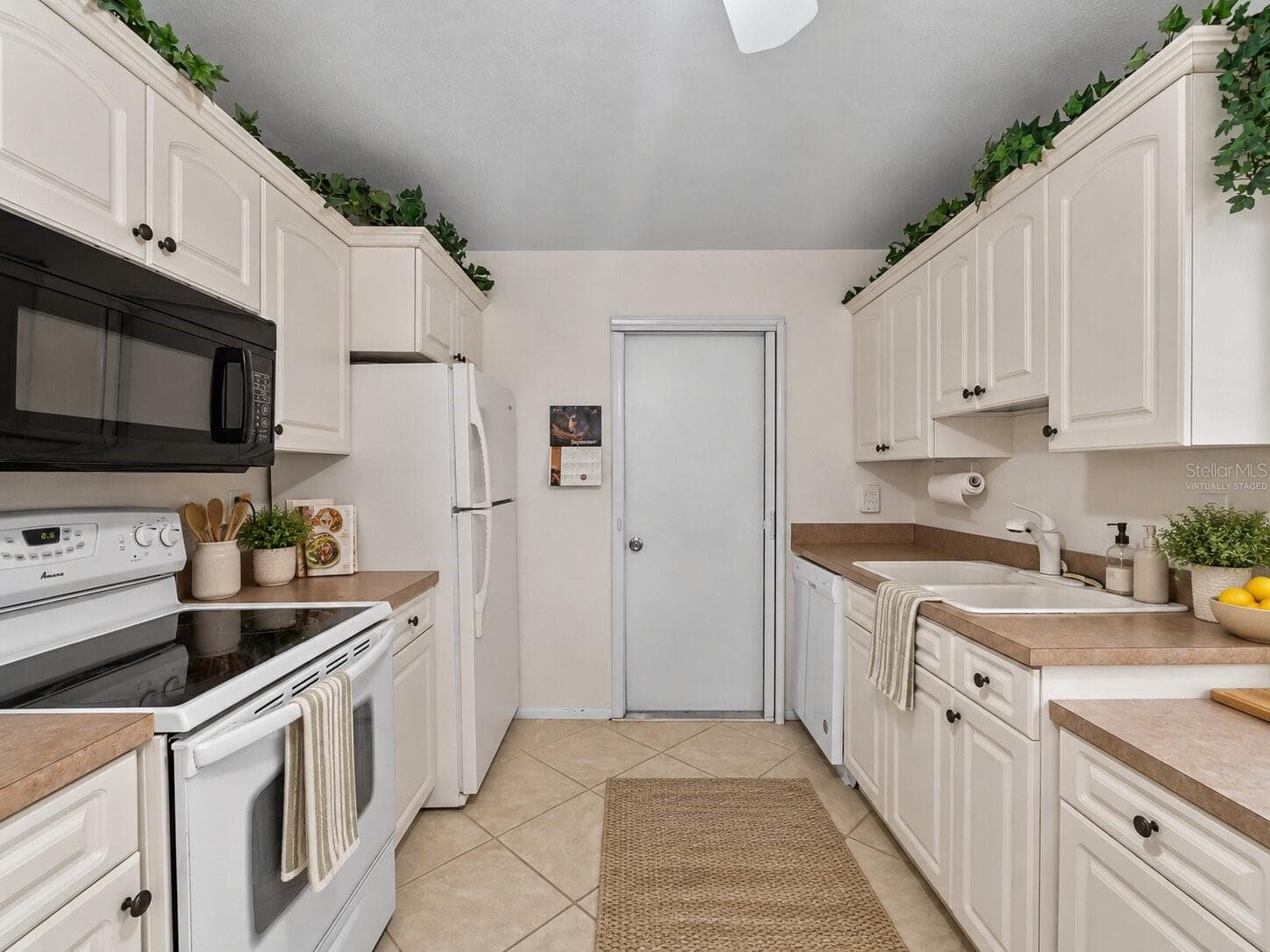 Virtually Staged Kitchen_8130PickwickRd_NorthPort_WhiteCabinetry_Wide2.jpg - 8130 PICKWICK RD, NORTH PORT