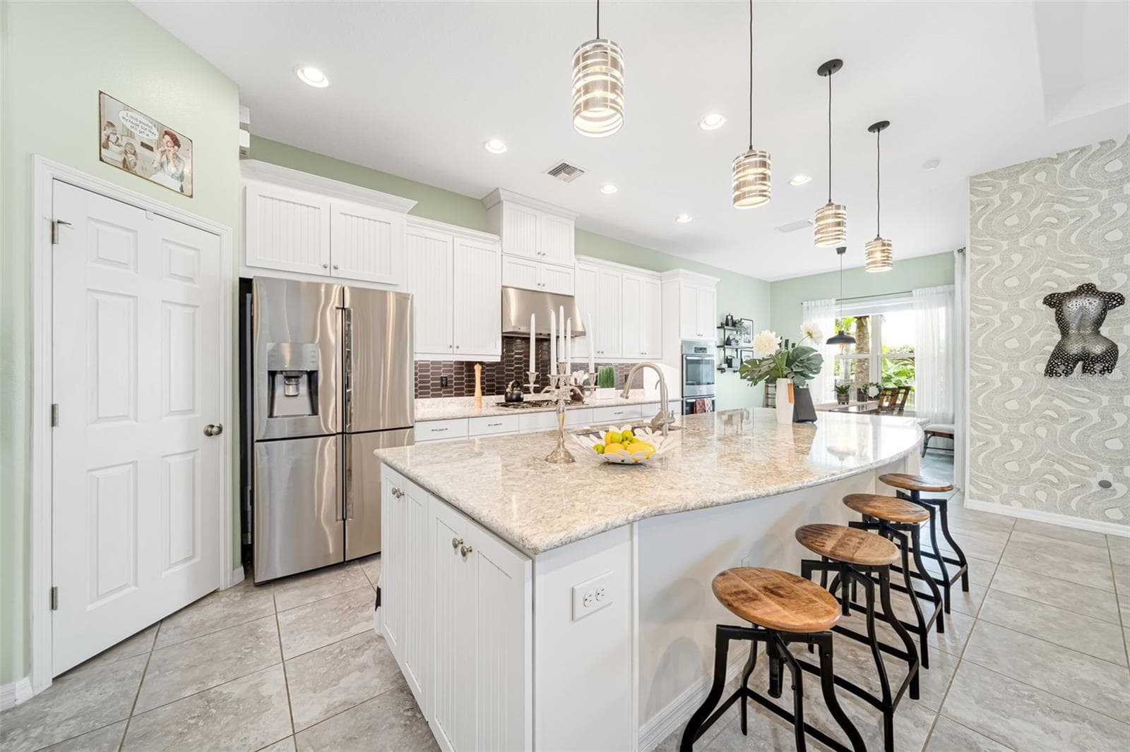 A chef-inspired kitchen with a gas range and custom finishes ideal for cooking and entertaining. - 6195 ANISE DR, SARASOTA