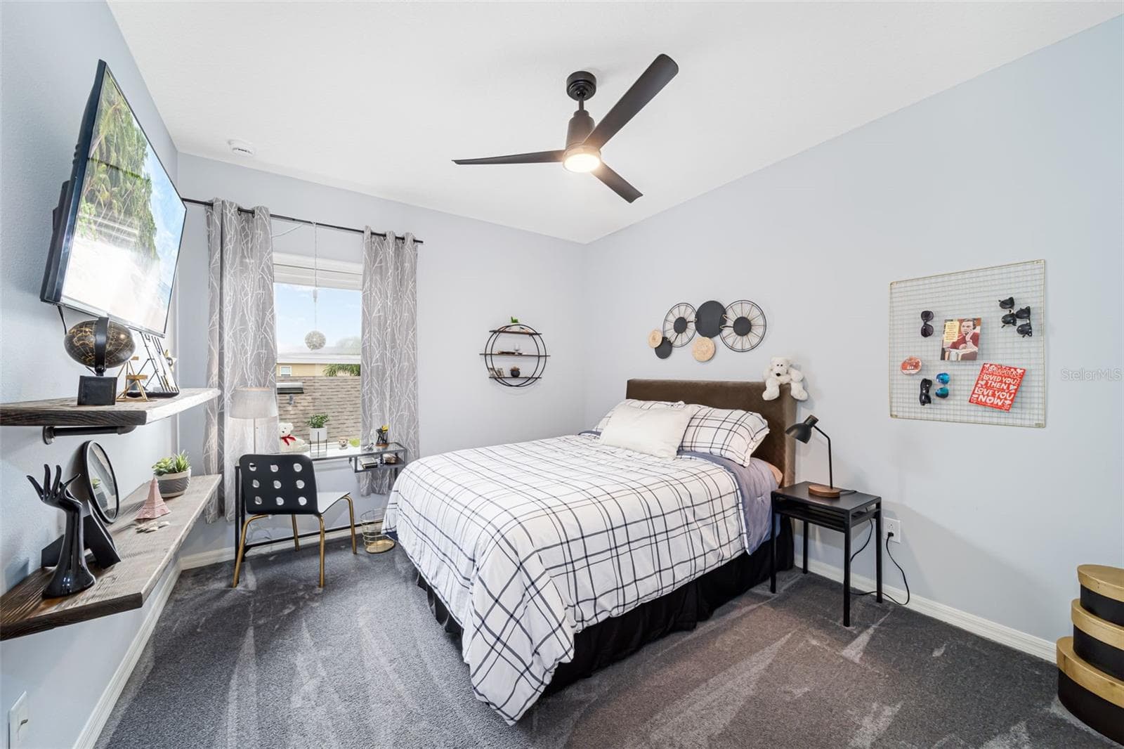 Comfortable third bedroom with built-in closet storage. - 6195 ANISE DR, SARASOTA