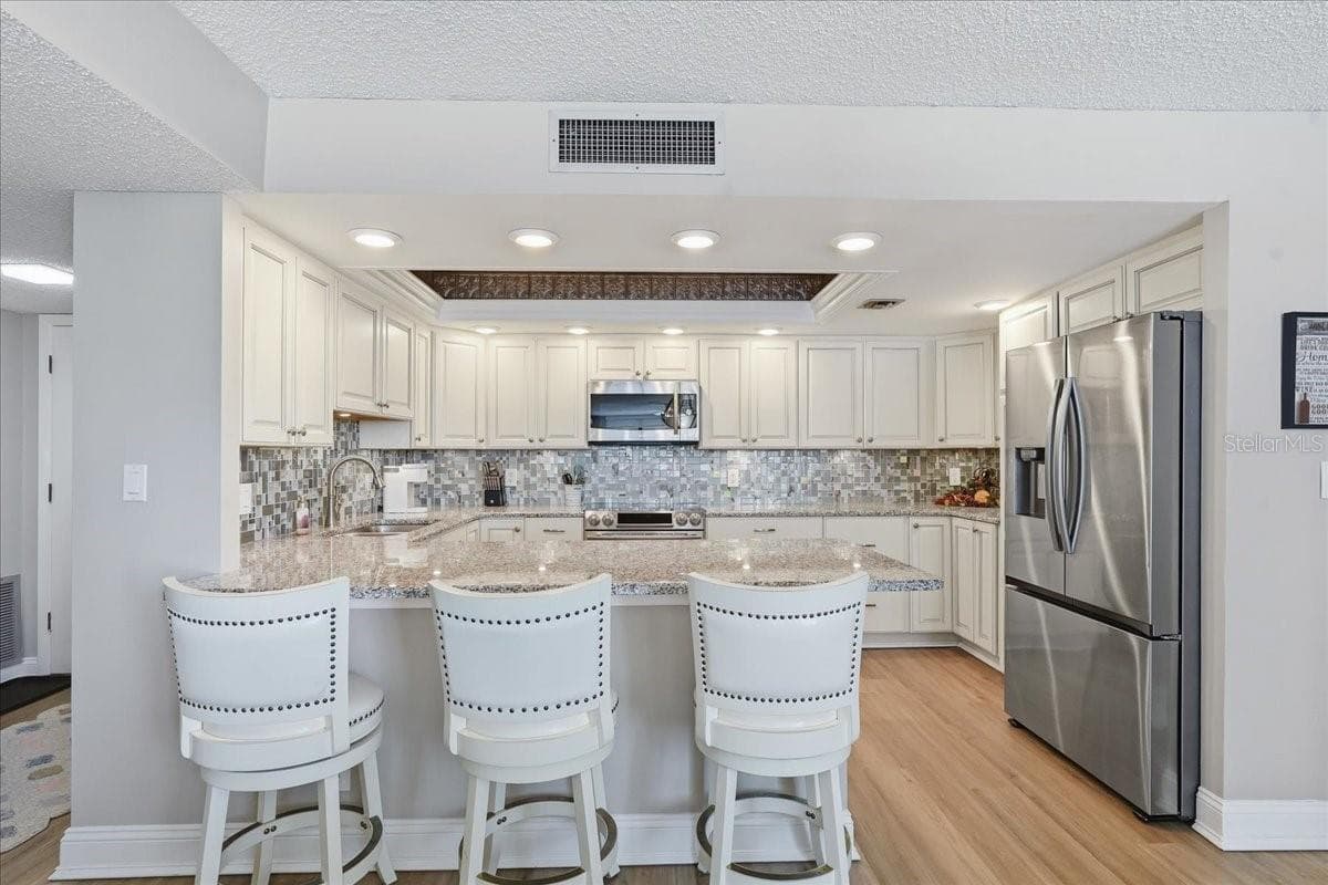 BREAKFAST BAR ADDING EXTRA SEATING AT DINNER TIME - 1430 GULF BLVD #407, CLEARWATER BEACH