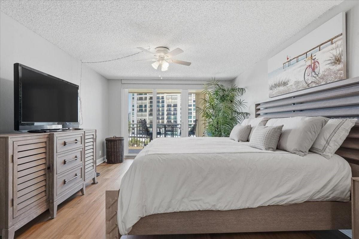 PRIMARY SUITE WITH NEWER PGT SLIDER DOOR - 1430 GULF BLVD #407, CLEARWATER BEACH
