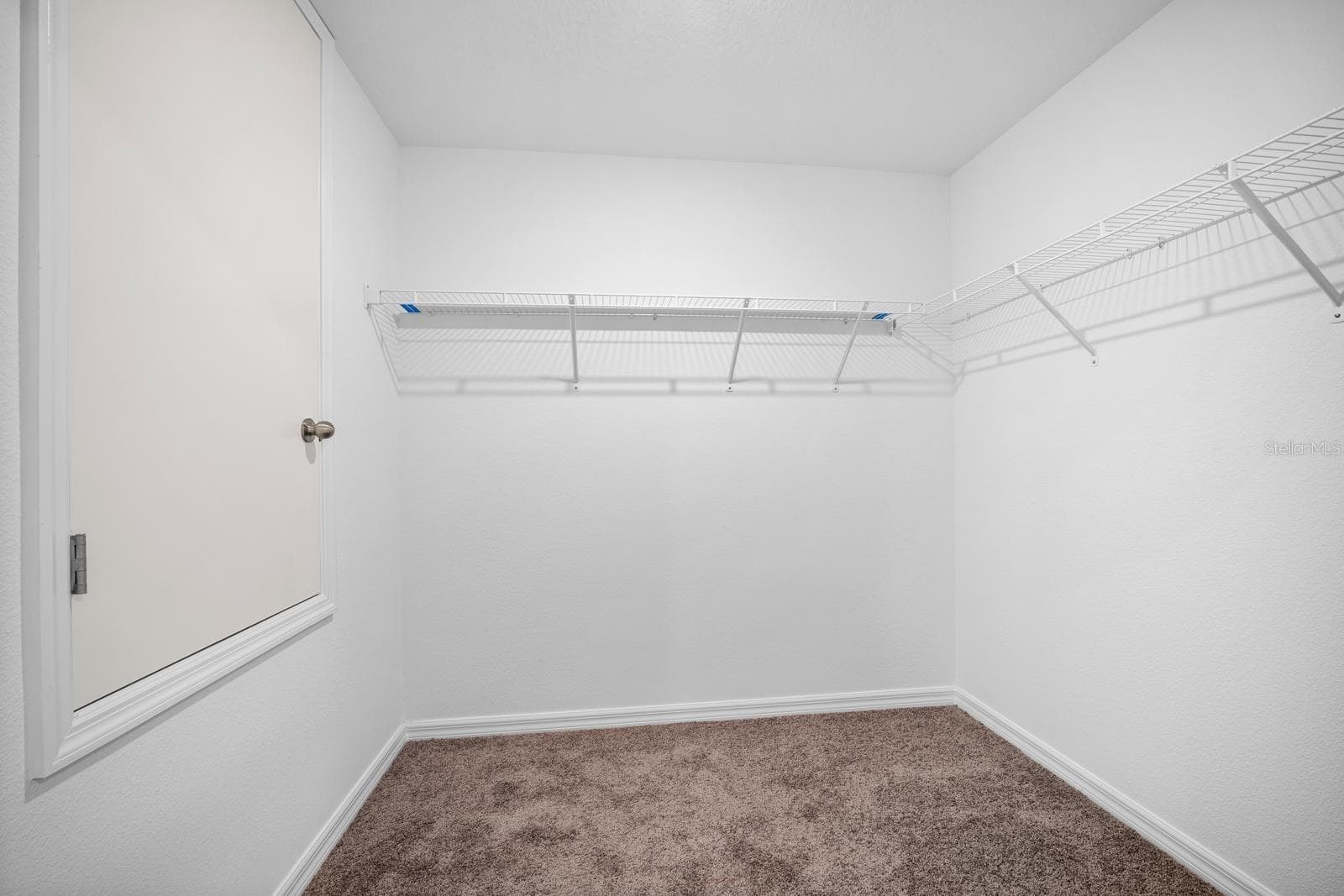Walk-in Closet in Primary Suite - 1983 FAN ALOE WAY, RUSKIN