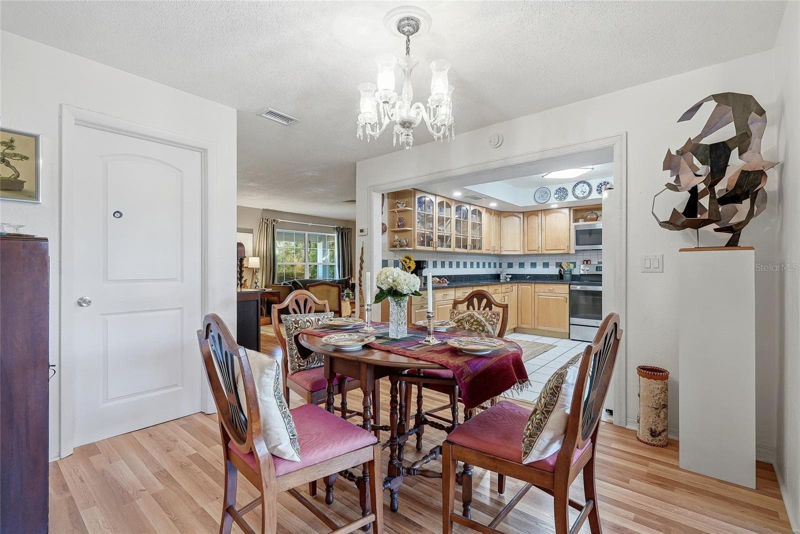 From everyday meals to special occasions, the dedicated dining area offers an inviting place to gather beside the family room. - 1890 62ND AVE S, ST PETERSBURG