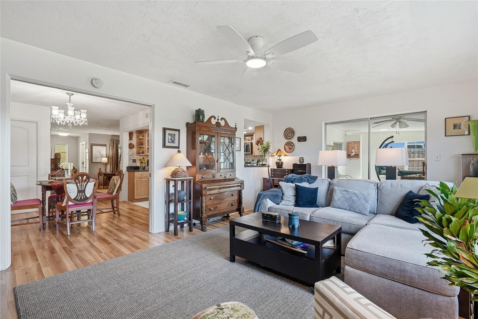 Space to spread out and stay connected, with the family room opening to the dining area and enclosed Florida room. - 1890 62ND AVE S, ST PETERSBURG
