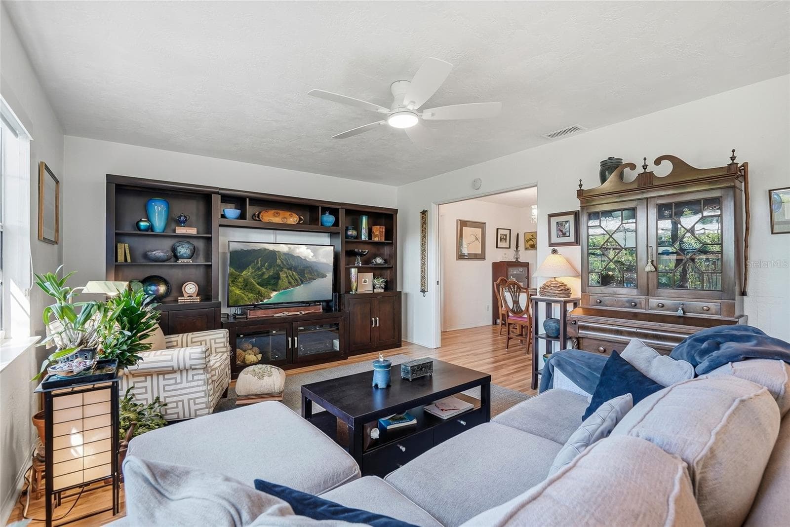 Picture movie nights or a quiet evening at home in this inviting family room, with generous space for comfortable seating and your entertainment setup. - 1890 62ND AVE S, ST PETERSBURG