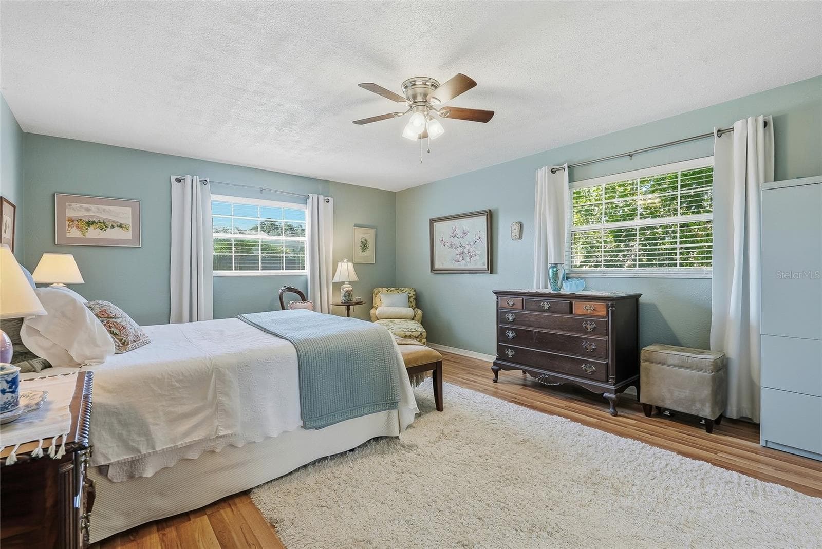 A restful retreat with windows on two walls, leafy views, and generous space to make the primary bedroom your own. - 1890 62ND AVE S, ST PETERSBURG