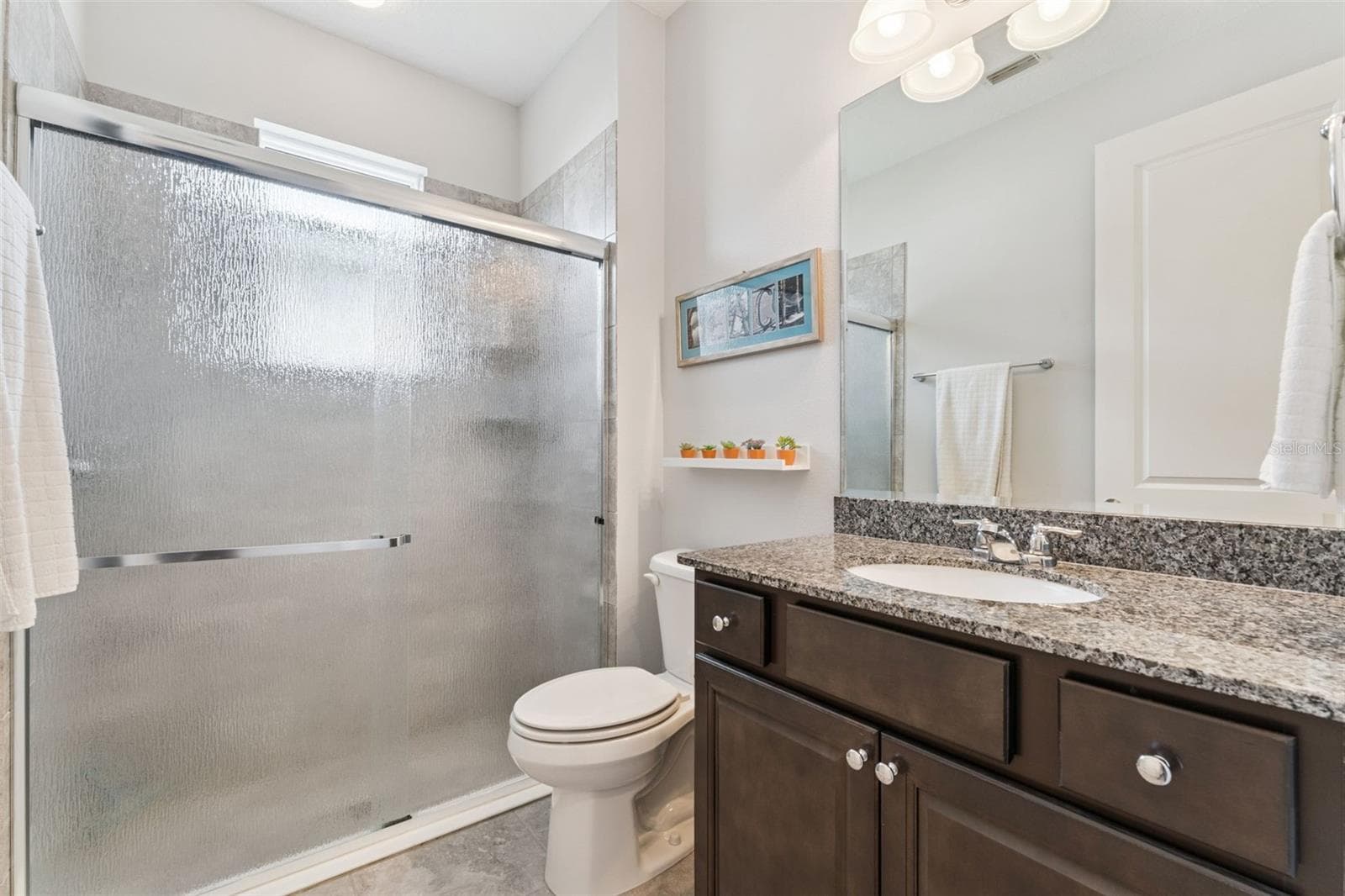 9' x 5'6" Guest Bathroom w/ walk-in shower & sliding glass door - 1305 HAYTON AVE., DELAND