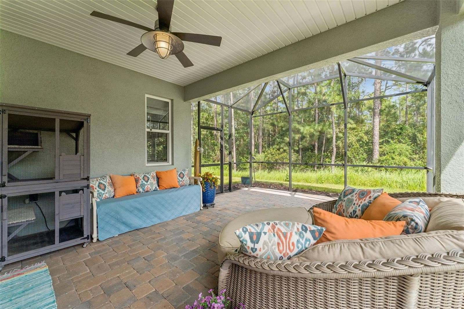 15' x 22' Screen enclosed covered patio w/ brick pavers & a conservation area view - 1305 HAYTON AVE., DELAND