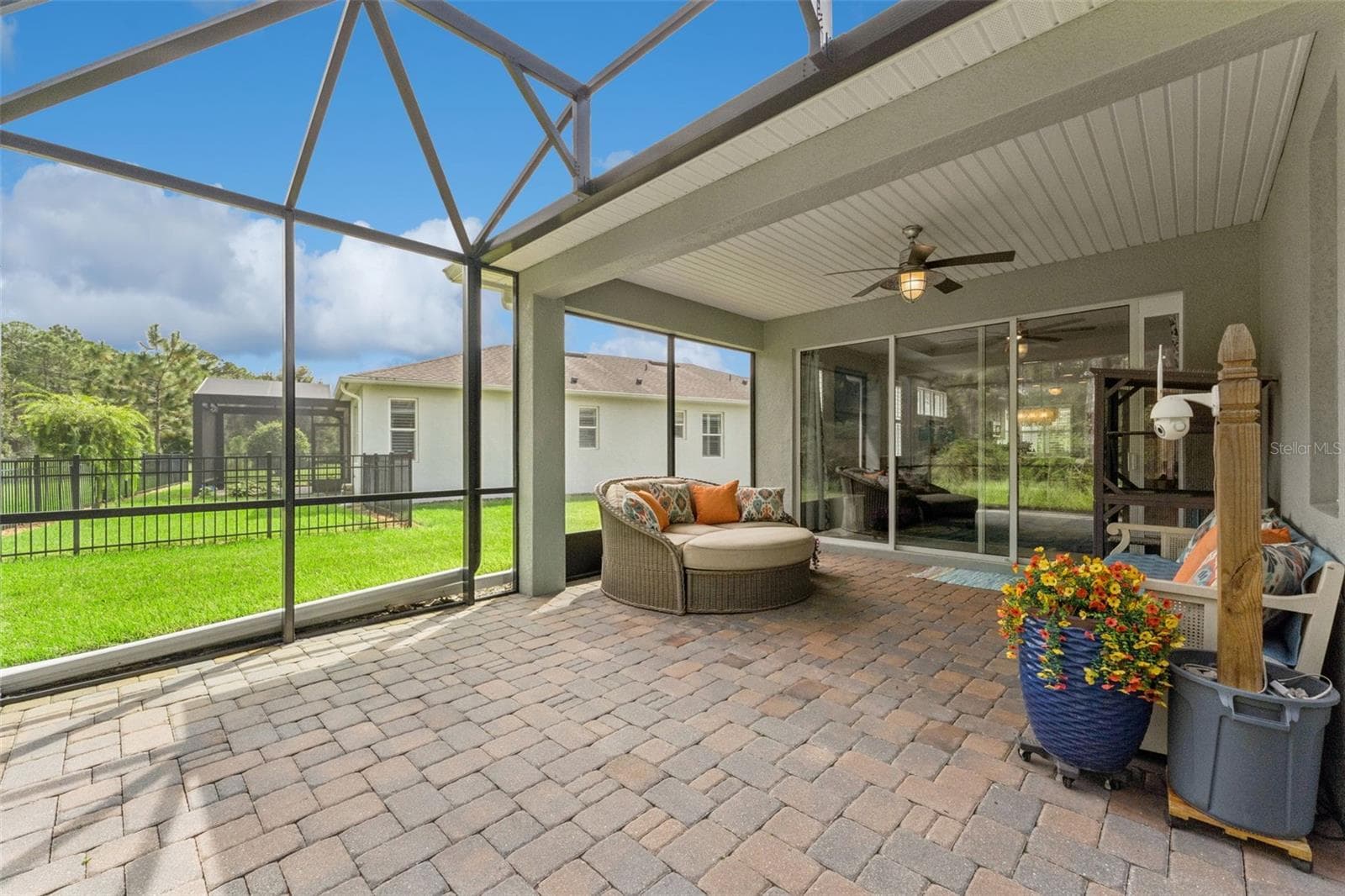 Screen enclosed covered patio w/ a ceiling fan - 1305 HAYTON AVE., DELAND