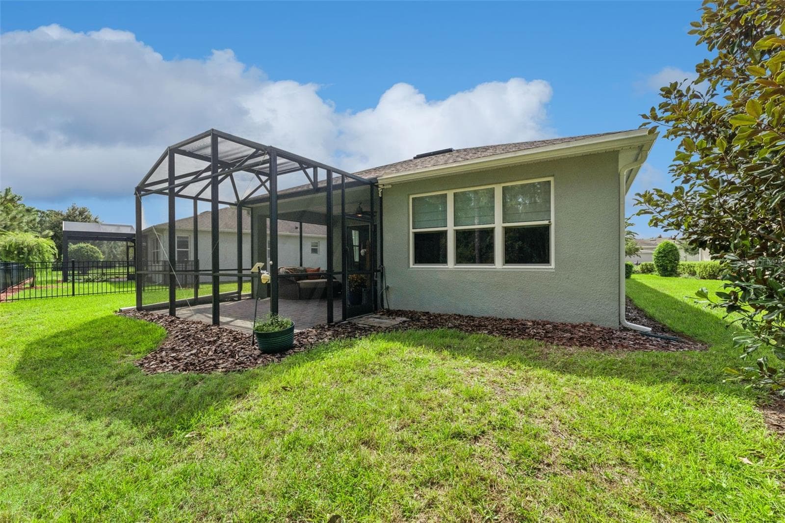 View of the screen enclosed Lanai & spacious backyard - 1305 HAYTON AVE., DELAND