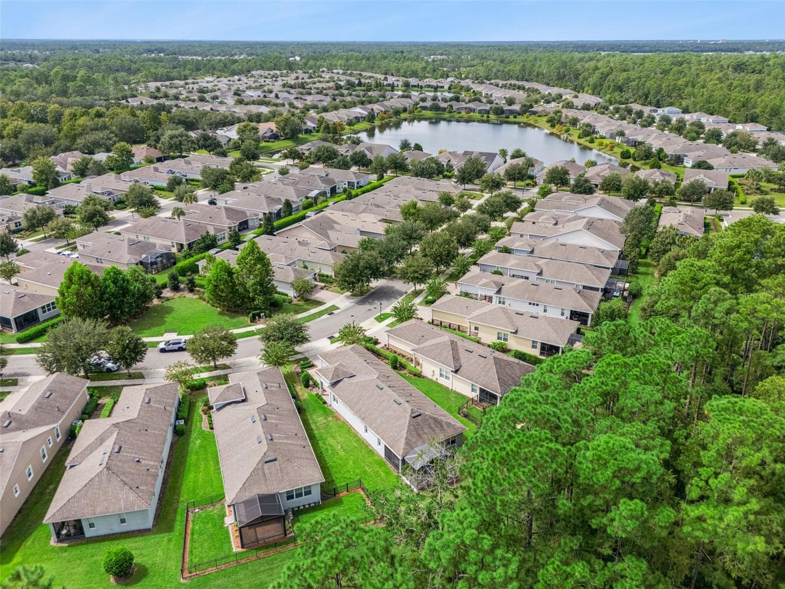 Aerial view from behind the Home overlooking a conservation area - 1305 HAYTON AVE., DELAND