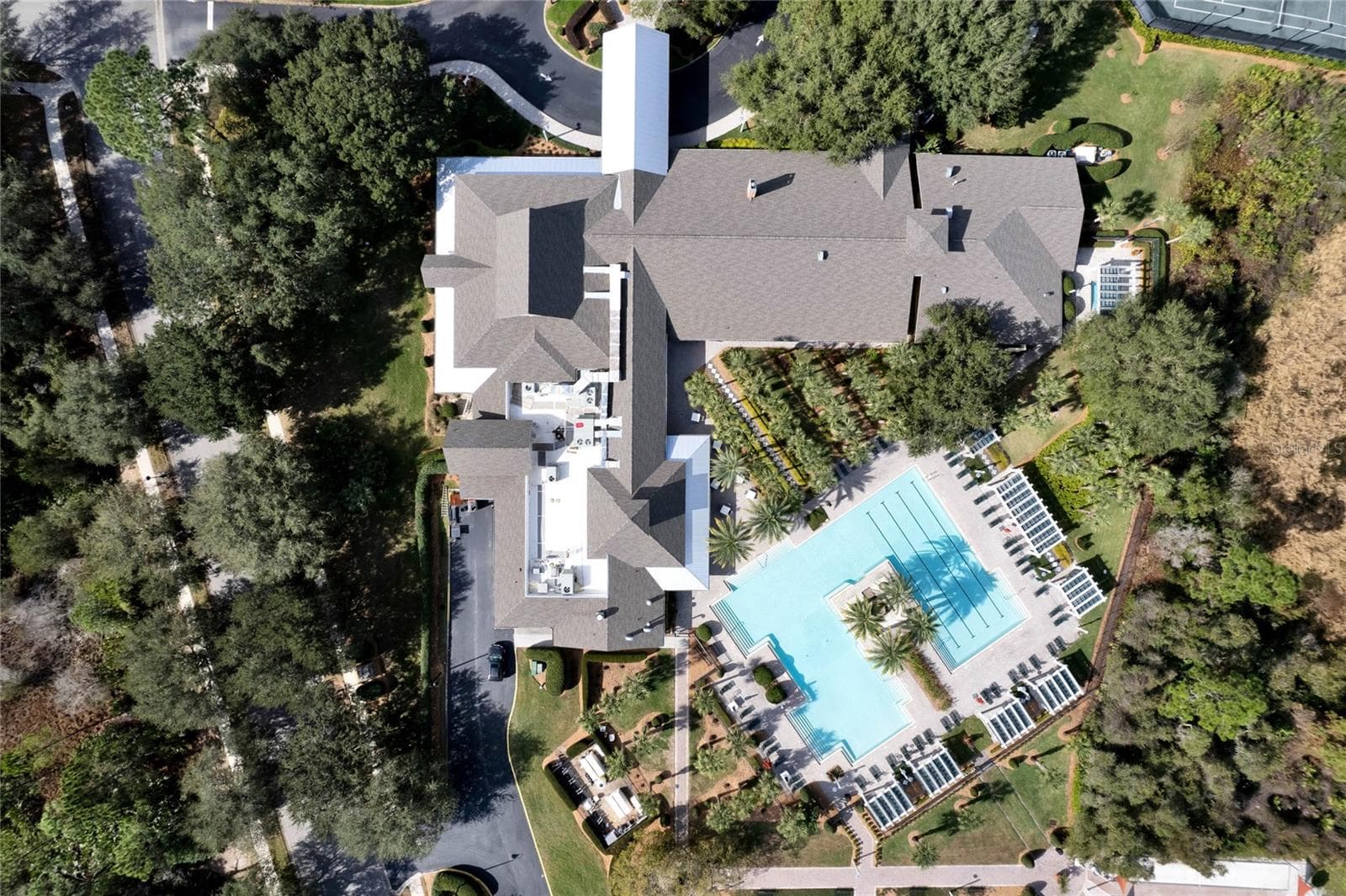 Aerial view from above the Victoria Gardens clubhouse & resort style heated pool - 1305 HAYTON AVE., DELAND