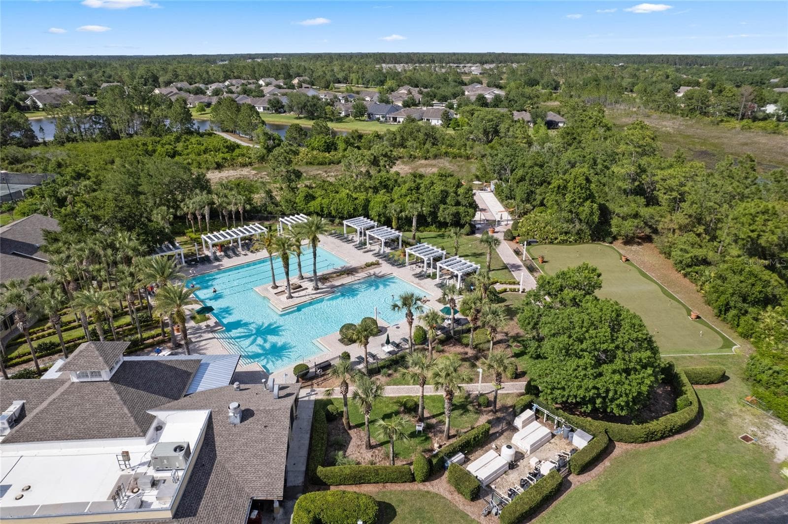 Aerial view of the Victoria Gardens resort style heated pool, putting green & bocce ball courts - 1305 HAYTON AVE., DELAND