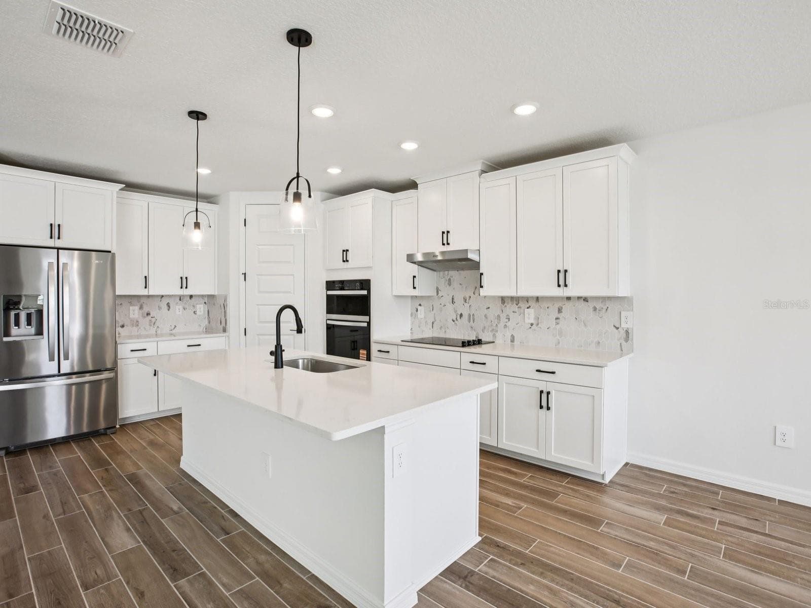 Photo is not of the actual home, but is an inspirational photo of builder’s model home and may depict options, furnishings, and/or decorator features that are not included. - 43 GARNI DR, PALM COAST