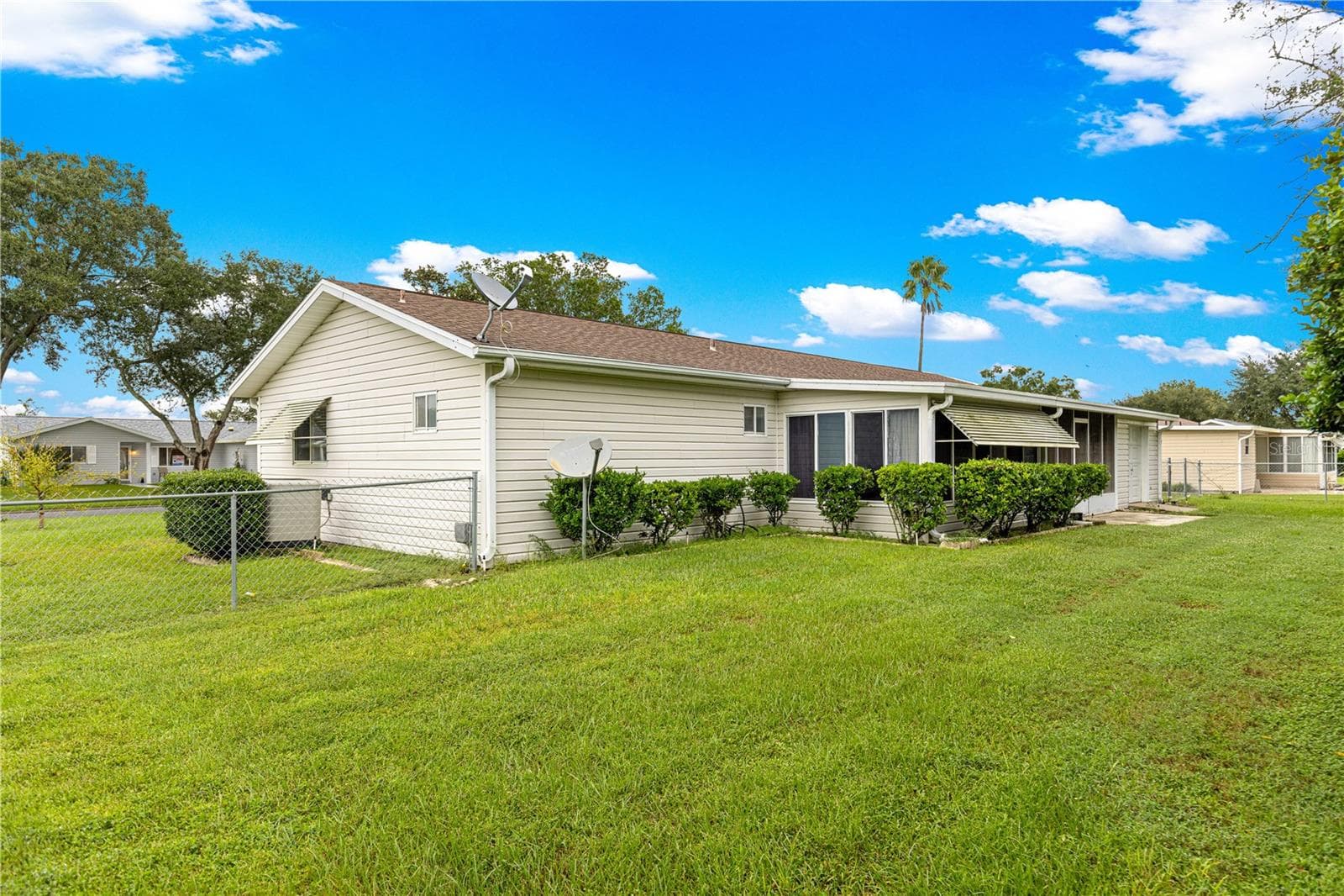 BACK ANGLE VIEW FROM LEFT TO BACK OF HOME H.V.A.C. IS SHOWING HERE ALSO - 10434 SE 178TH PL, SUMMERFIELD