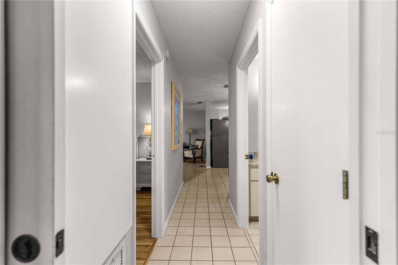 TILED HALLWAY CENTRAL LIVING AREA FROM BEDROOMS - 10434 SE 178TH PL, SUMMERFIELD