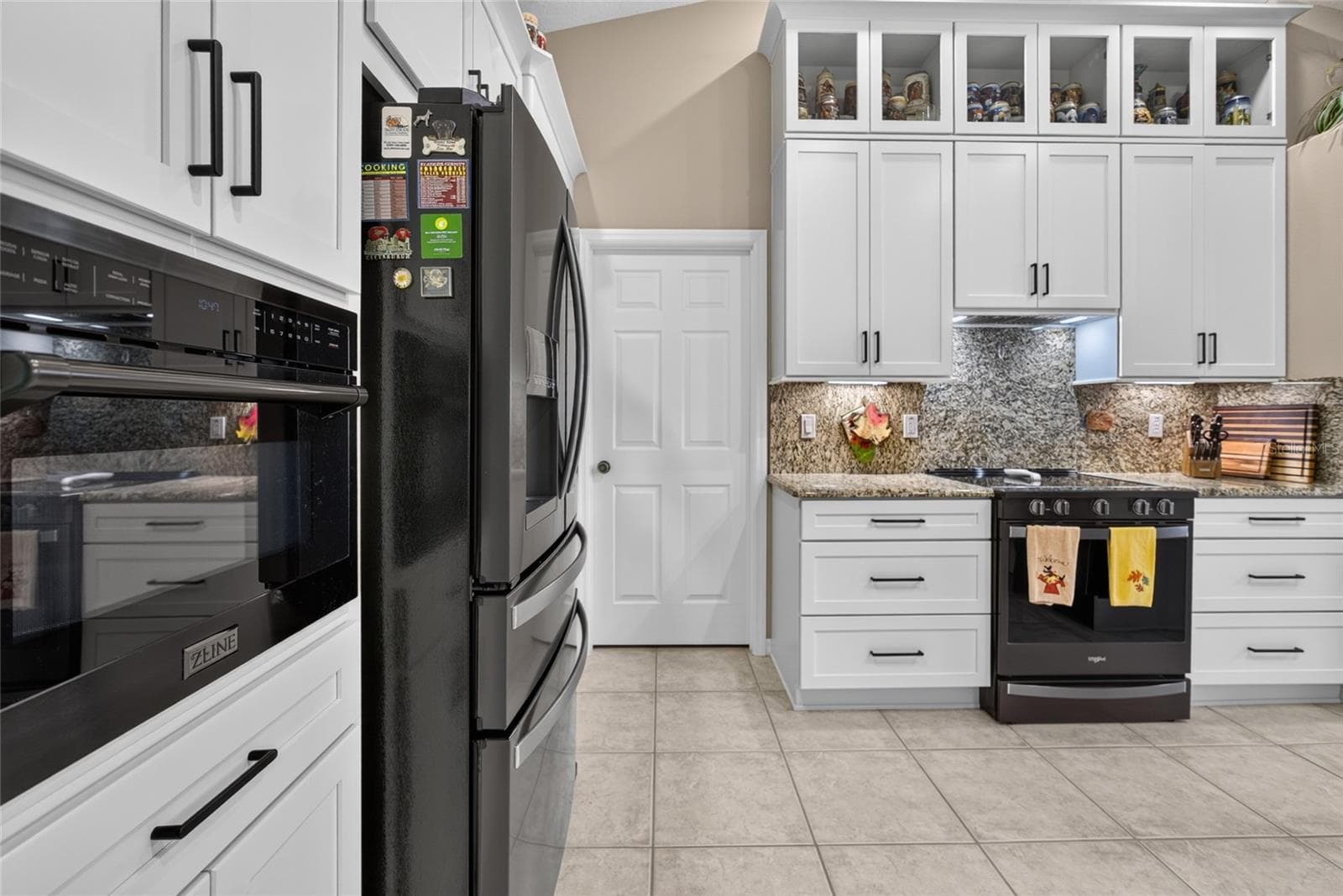 Kitchen with beautiful granite counters and backsplash. - 110 BURROUGHS DR, PALM COAST