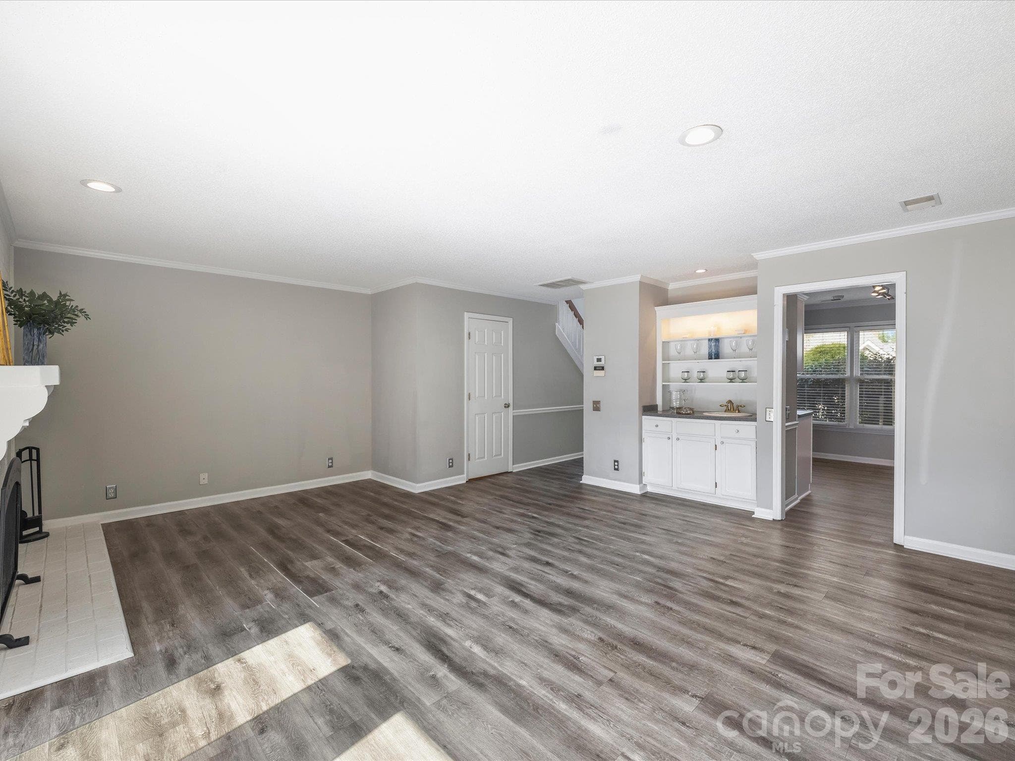 Living Room with Door to Powder Room - 7243 Meeting Street, Charlotte