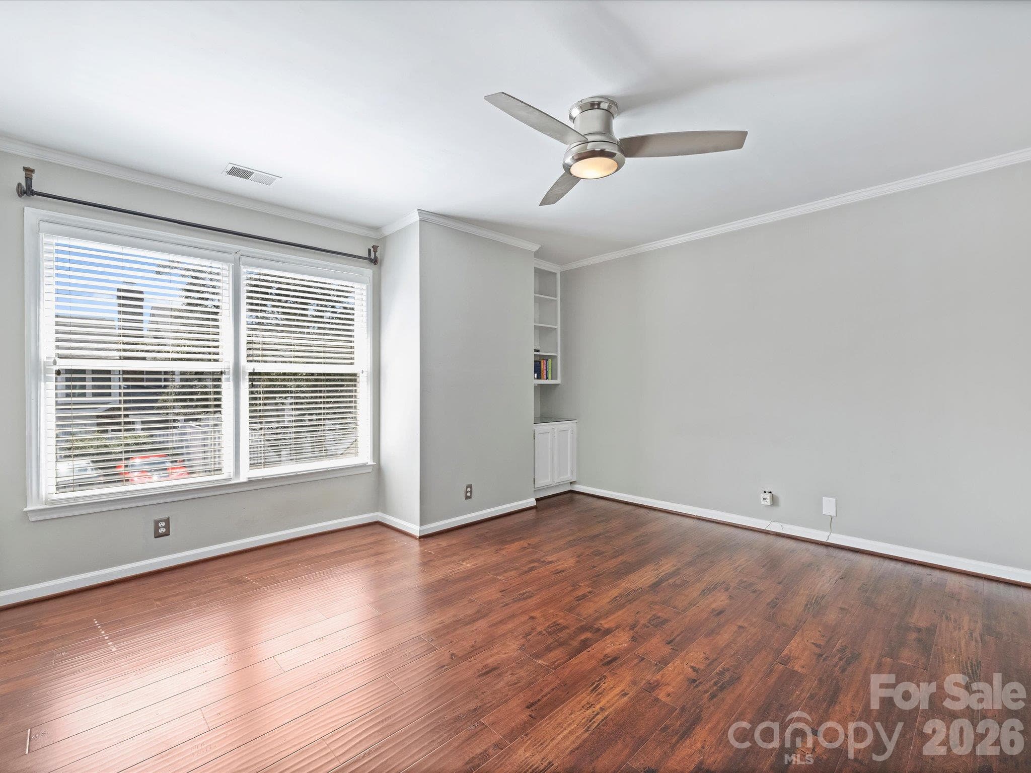 Primary Bedroom with Built-In Bookcase and Walk-In Closet - 7243 Meeting Street, Charlotte