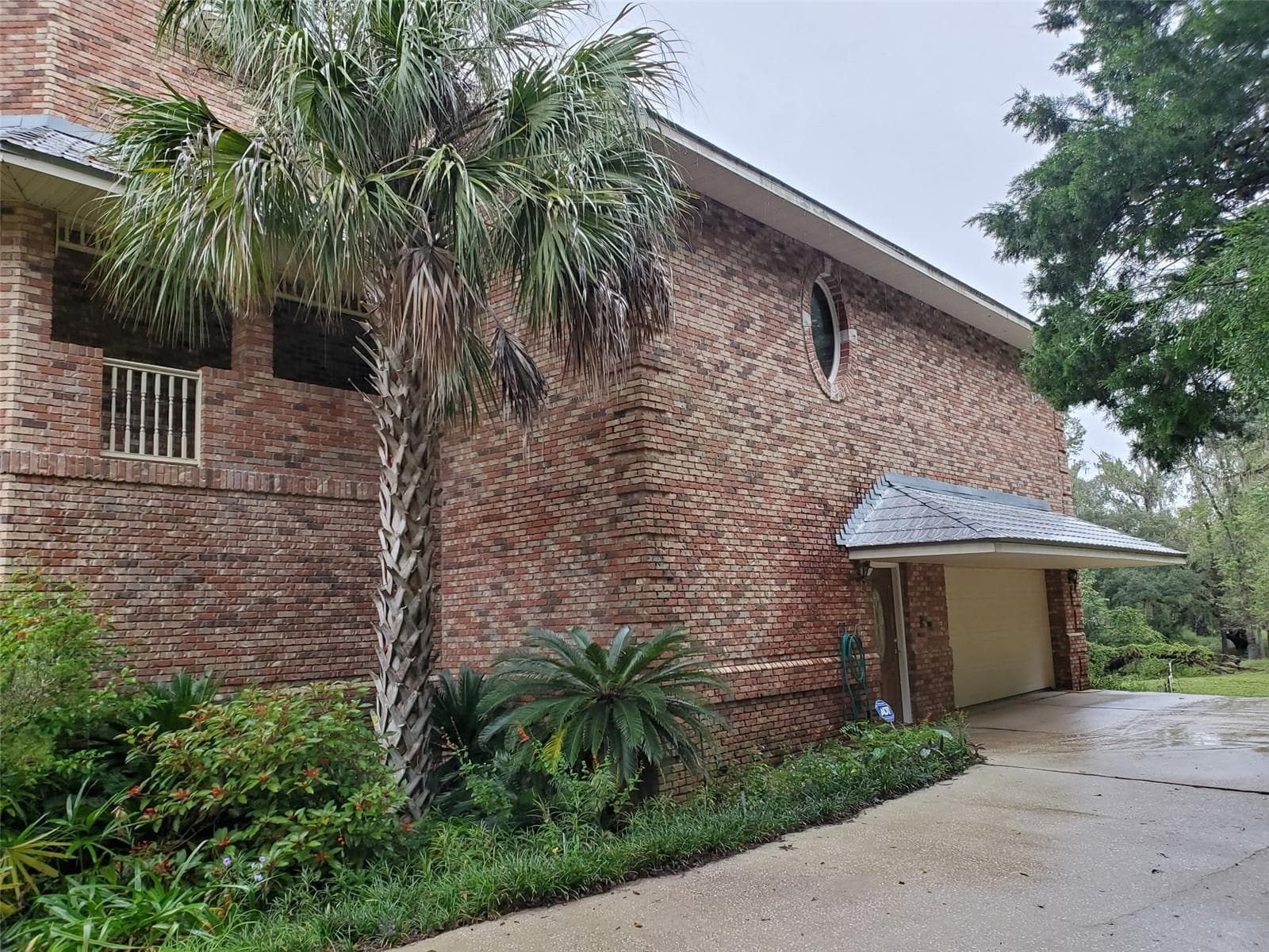 First floor is concrete block with brick. 2nd and 3rd floor is wood frame, with plywood and brick construction. - 5422 CYRIL DR, DADE CITY