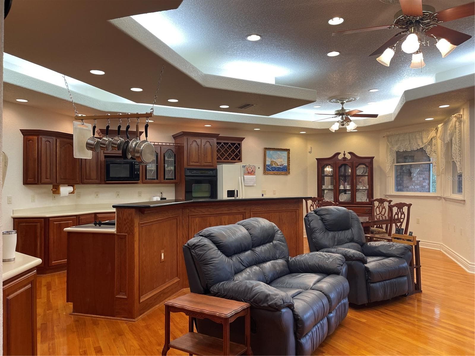 Living room and kitchen has lots of recessed lighting. - 5422 CYRIL DR, DADE CITY