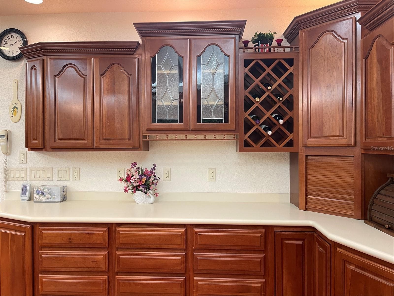 Schrock handcrafted Cherry wood cabinetry and stain glass accent panels. - 5422 CYRIL DR, DADE CITY