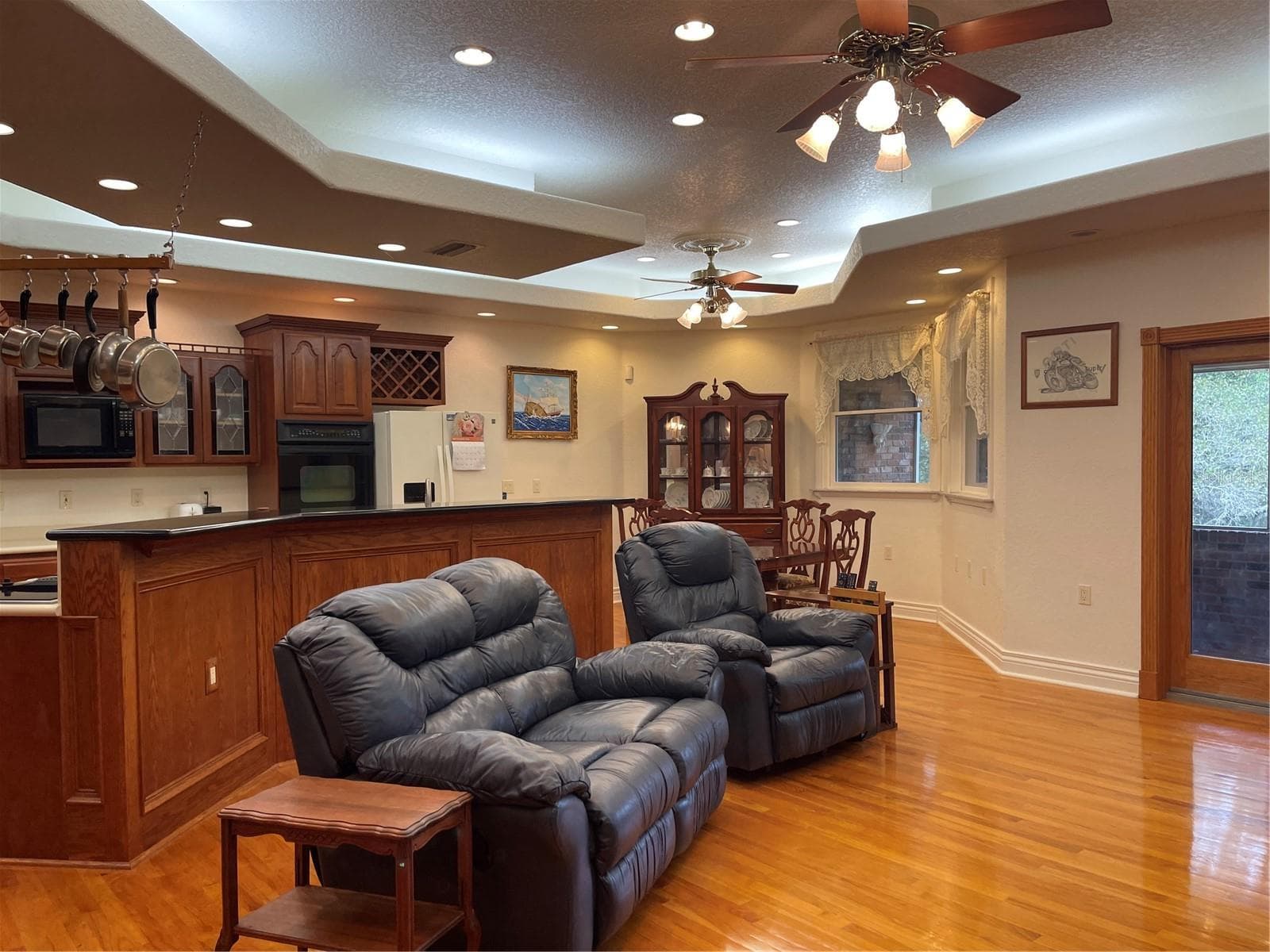 Ceiling fans are made of real brass in this room. - 5422 CYRIL DR, DADE CITY