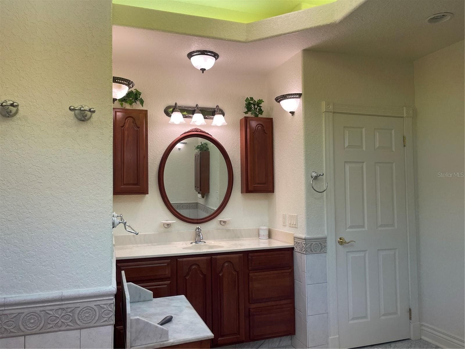 Linen closet to the right of vanity. - 5422 CYRIL DR, DADE CITY