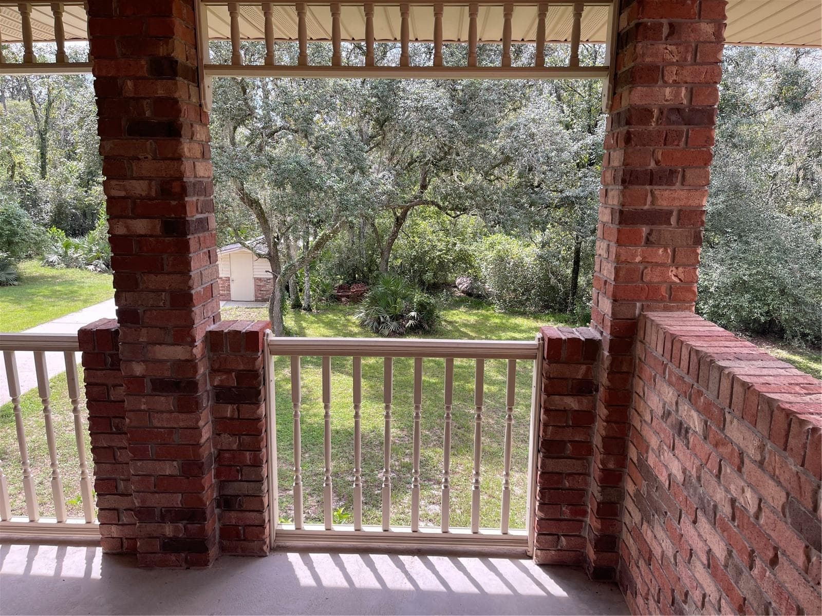 Balcony view at the front of the property is 289 sq ft. - 5422 CYRIL DR, DADE CITY