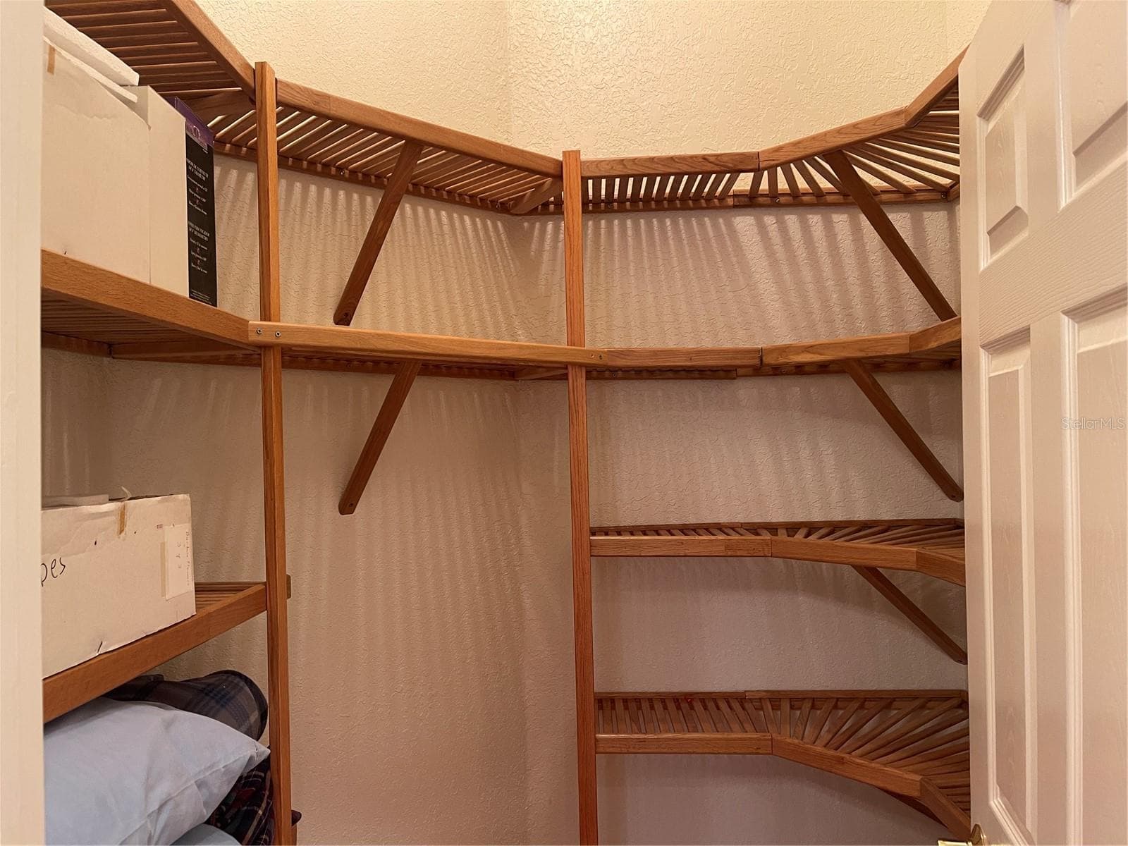 Closet has wood shelving - 5422 CYRIL DR, DADE CITY