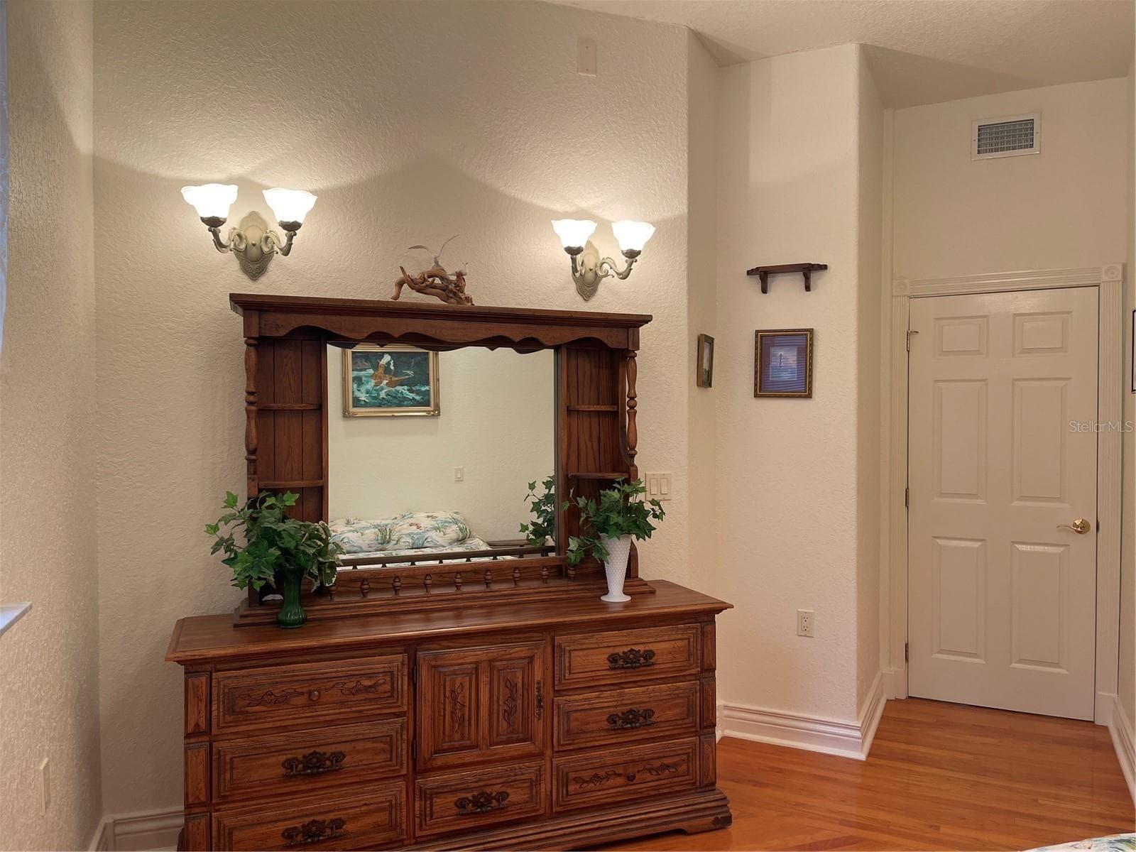 2nd bedroom features four sconse lights. - 5422 CYRIL DR, DADE CITY