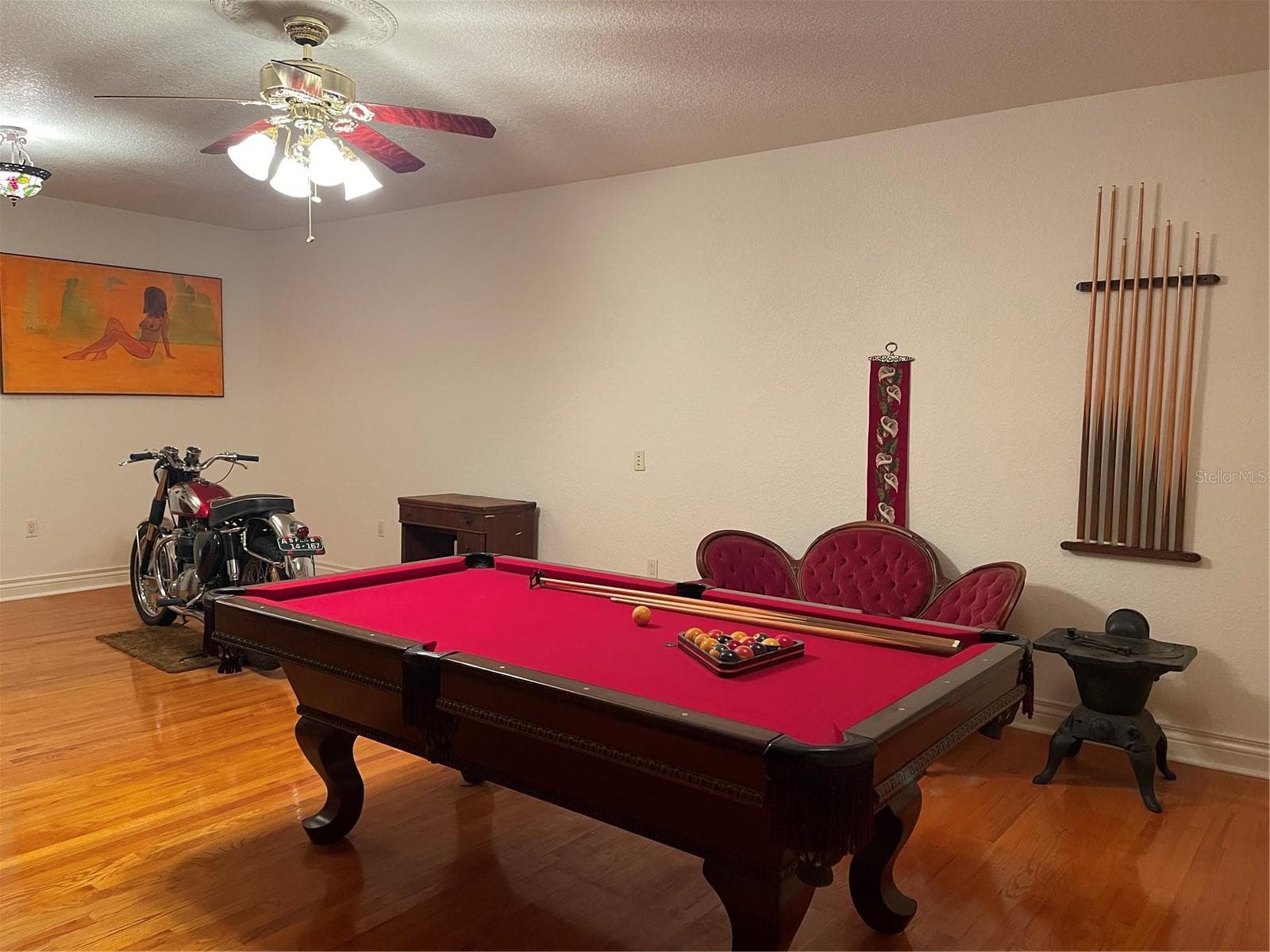 Bonus Room on 1st floor features 3/4 inch red oak flooring. - 5422 CYRIL DR, DADE CITY