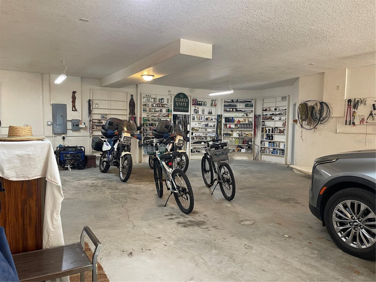The garage and workshop square footage is approximately 2,075 sq ft. Which does not include the additional two utility rooms - 5422 CYRIL DR, DADE CITY