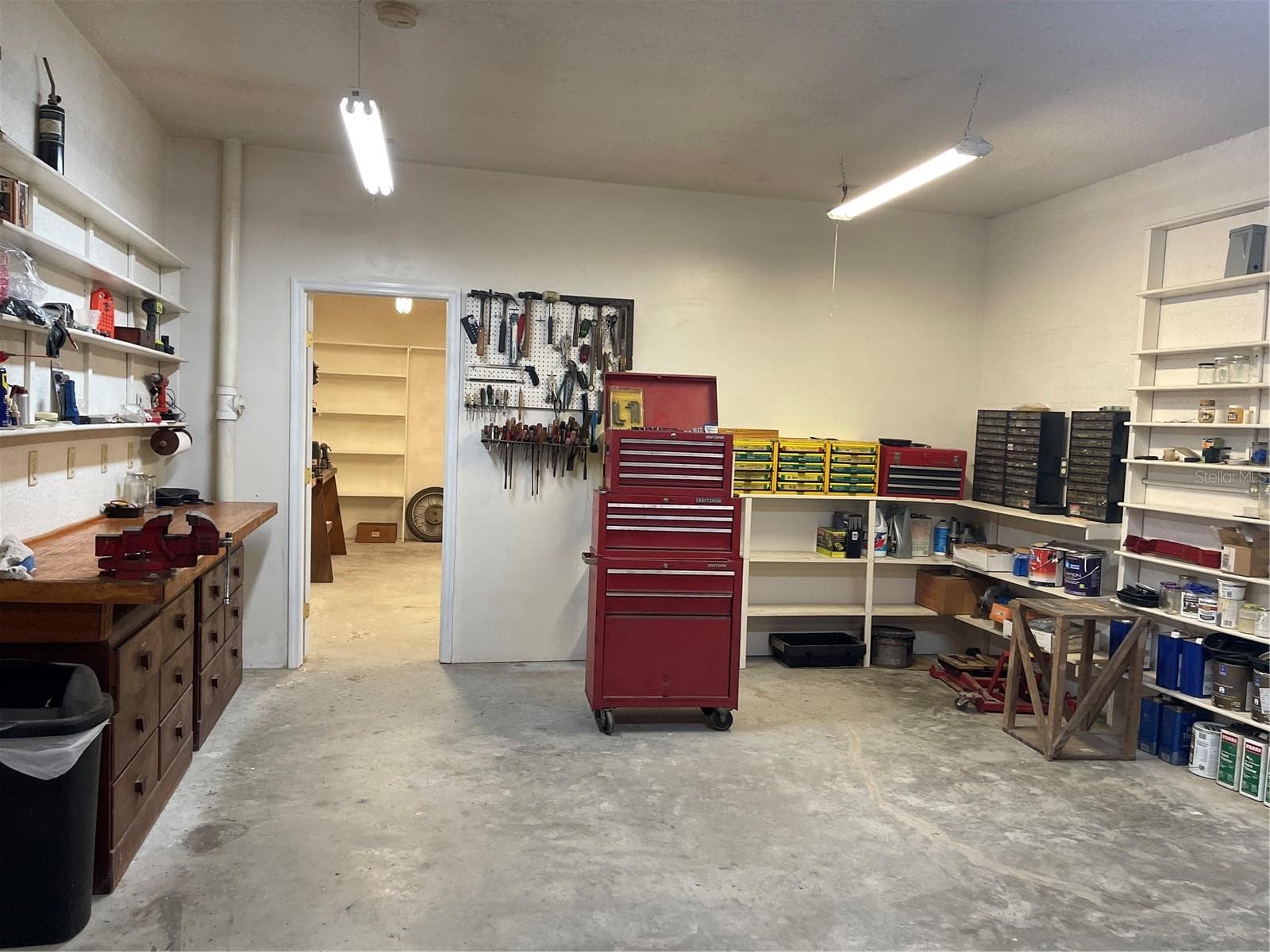 Workshop off to the right in garage through the door - 5422 CYRIL DR, DADE CITY