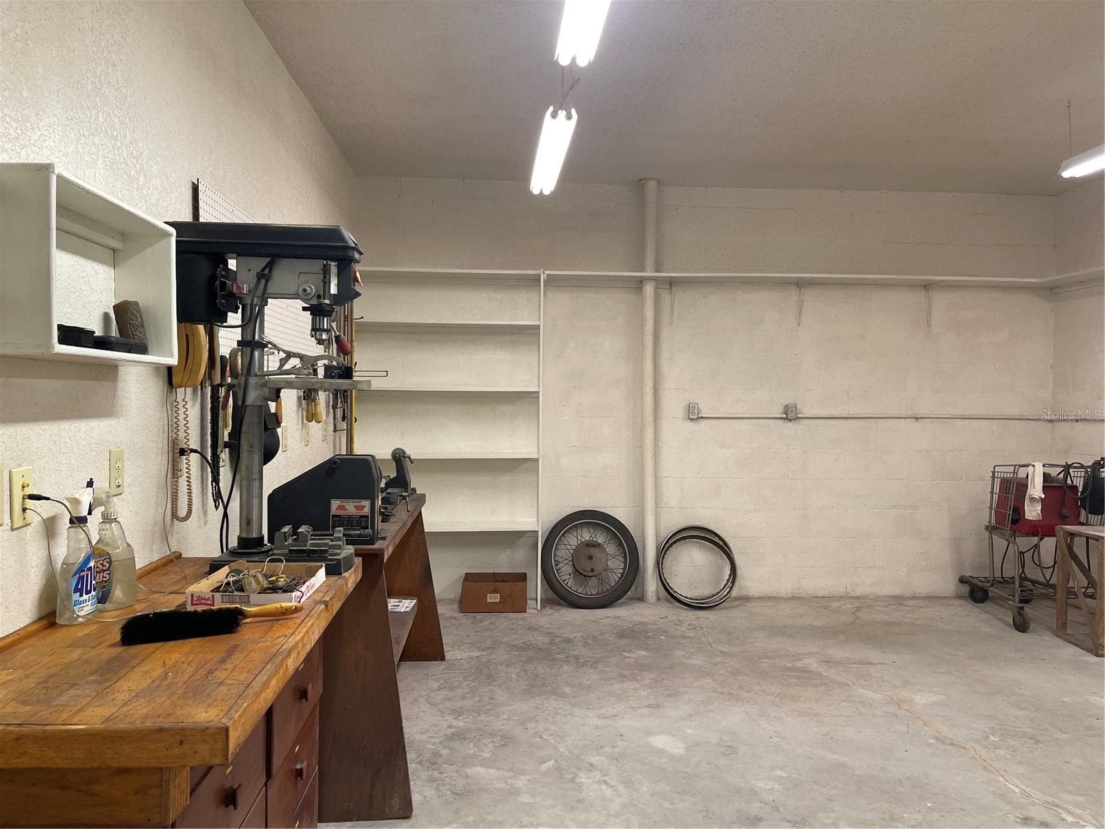 plenty of electric outlets in the workshop on first floor - 5422 CYRIL DR, DADE CITY