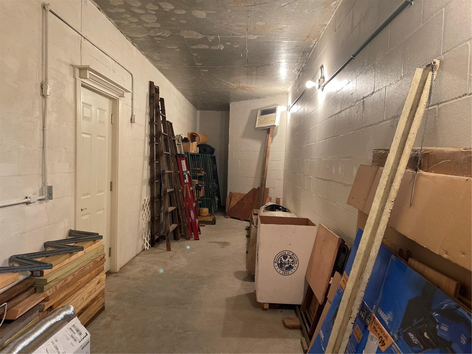 Plenty of electric outlets in this utility space that leads to backyard and river - 5422 CYRIL DR, DADE CITY