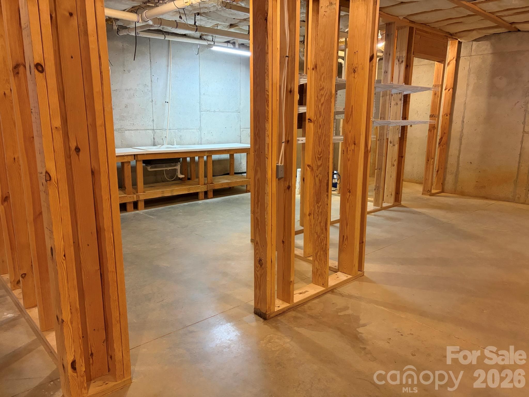 Unfinished basement: framed, plumbing and electrical rough-in - 11437 Corliss Avenue, Charlotte