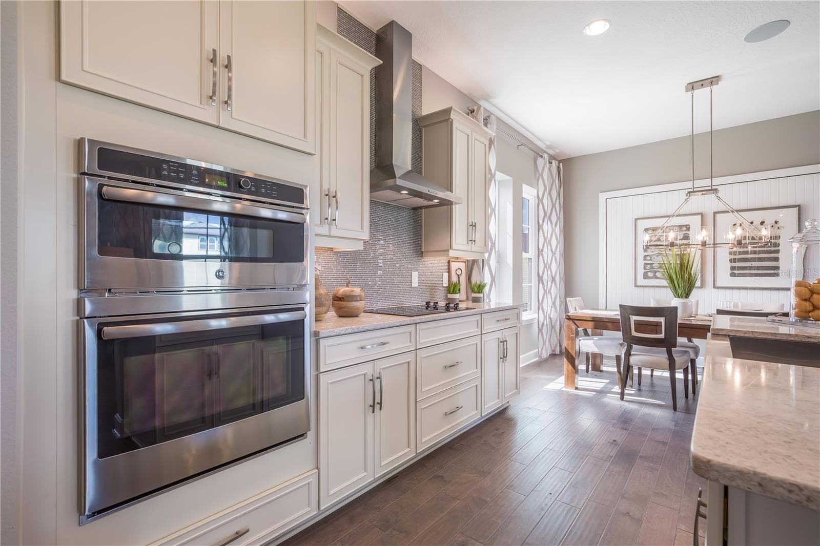 The sample photos included are of the model home and are meant to showcase the craftsmanship and design quality. - 9520 FLOREY WAY, ORLANDO