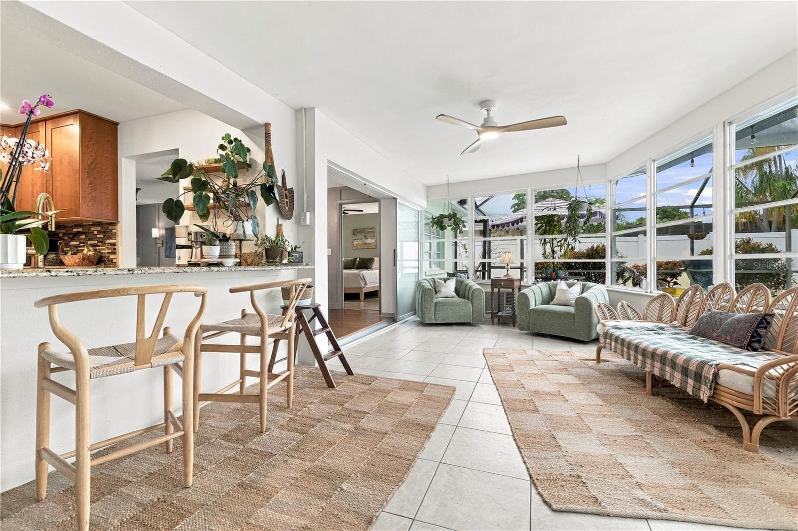 Sun room entry looking into dining and kitchen from family room - 10211 139TH ST, LARGO