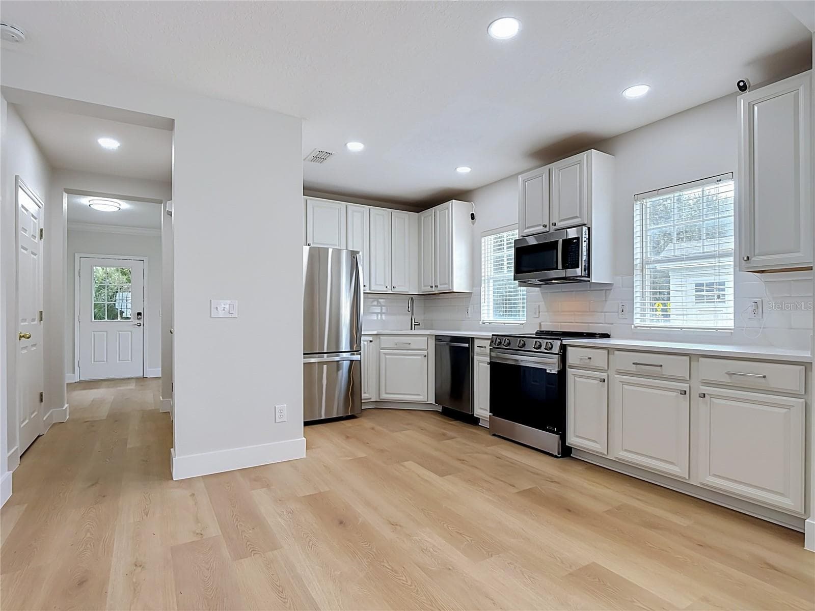 Hallway to Remodeled Kitchen - 1003 OLD BLUSH RD, CELEBRATION
