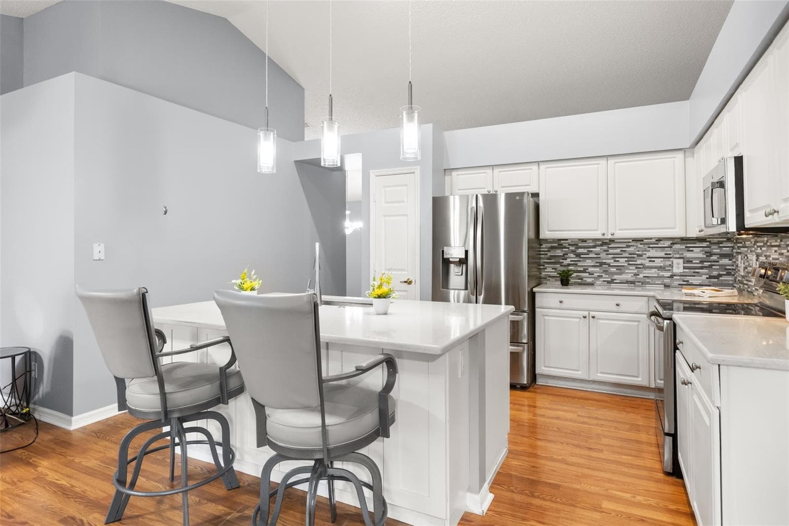 Large island for extra seating and there's cabinets for extra storage - 755 VIA MILANO, APOPKA