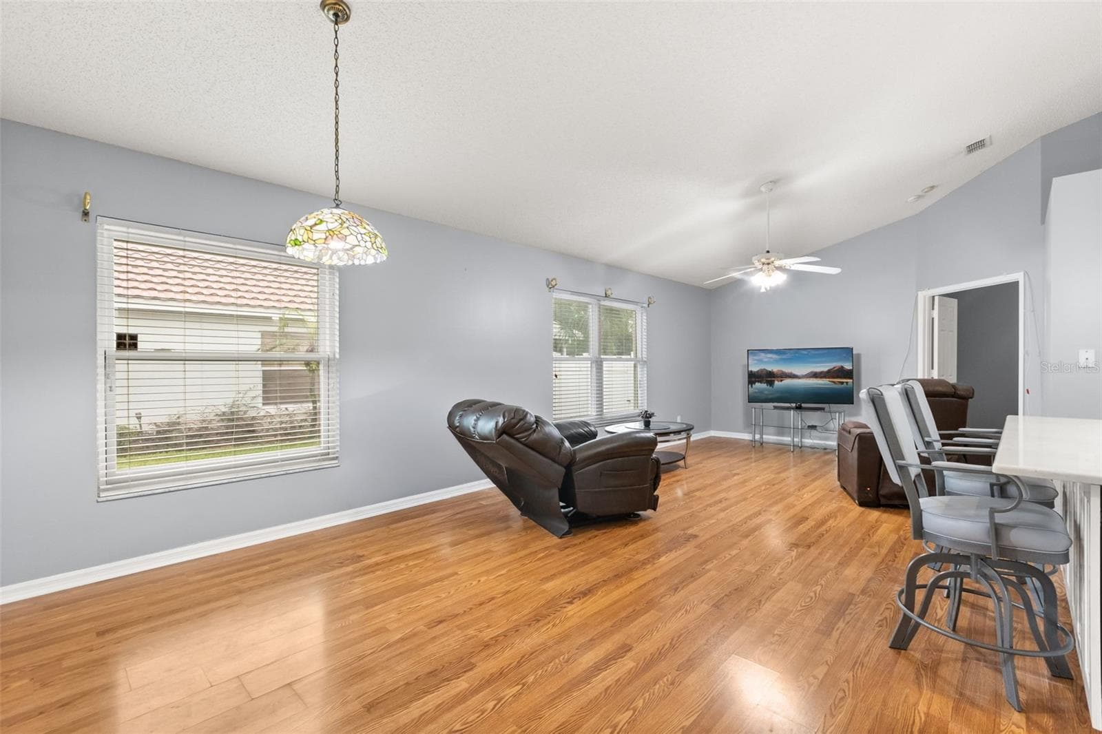 Family and dinette and entry to primary bedroom - 755 VIA MILANO, APOPKA