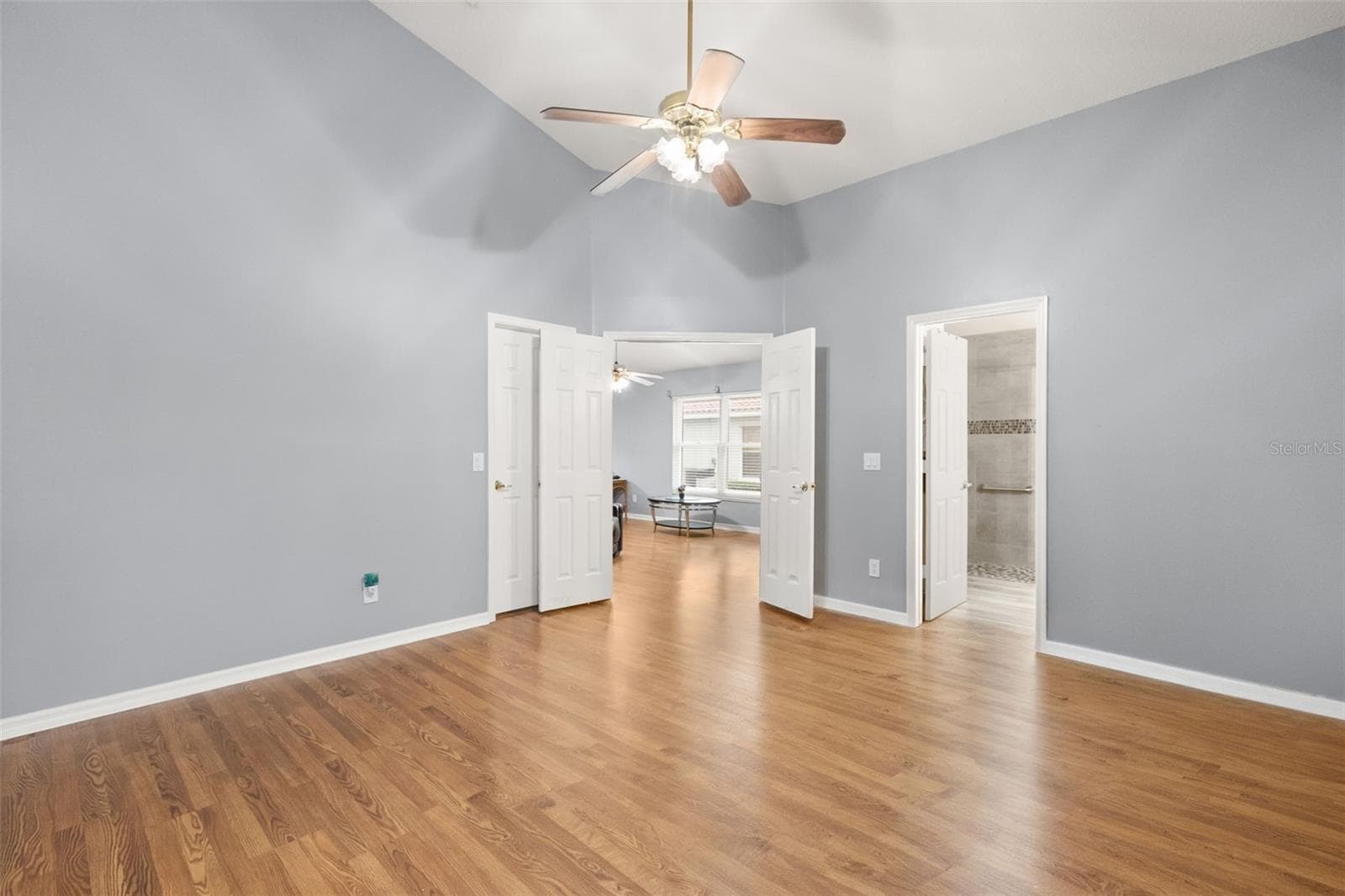 Primary bedroom with views of double entry French doors - 755 VIA MILANO, APOPKA