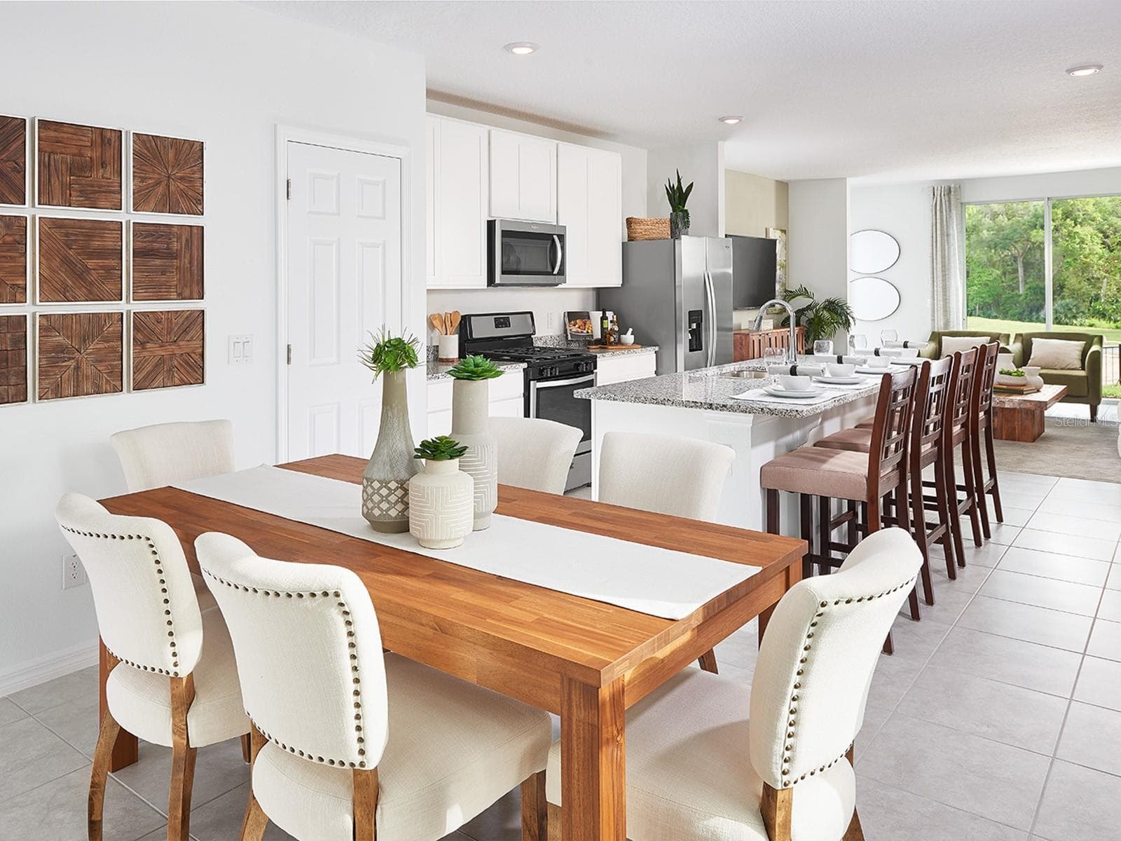 Photo is not of the actual home, but is an inspirational photo of builder’s model home and may depict options, furnishings, and/or decorator features that are not included. - 124 CANOE BEND AVE, NOKOMIS